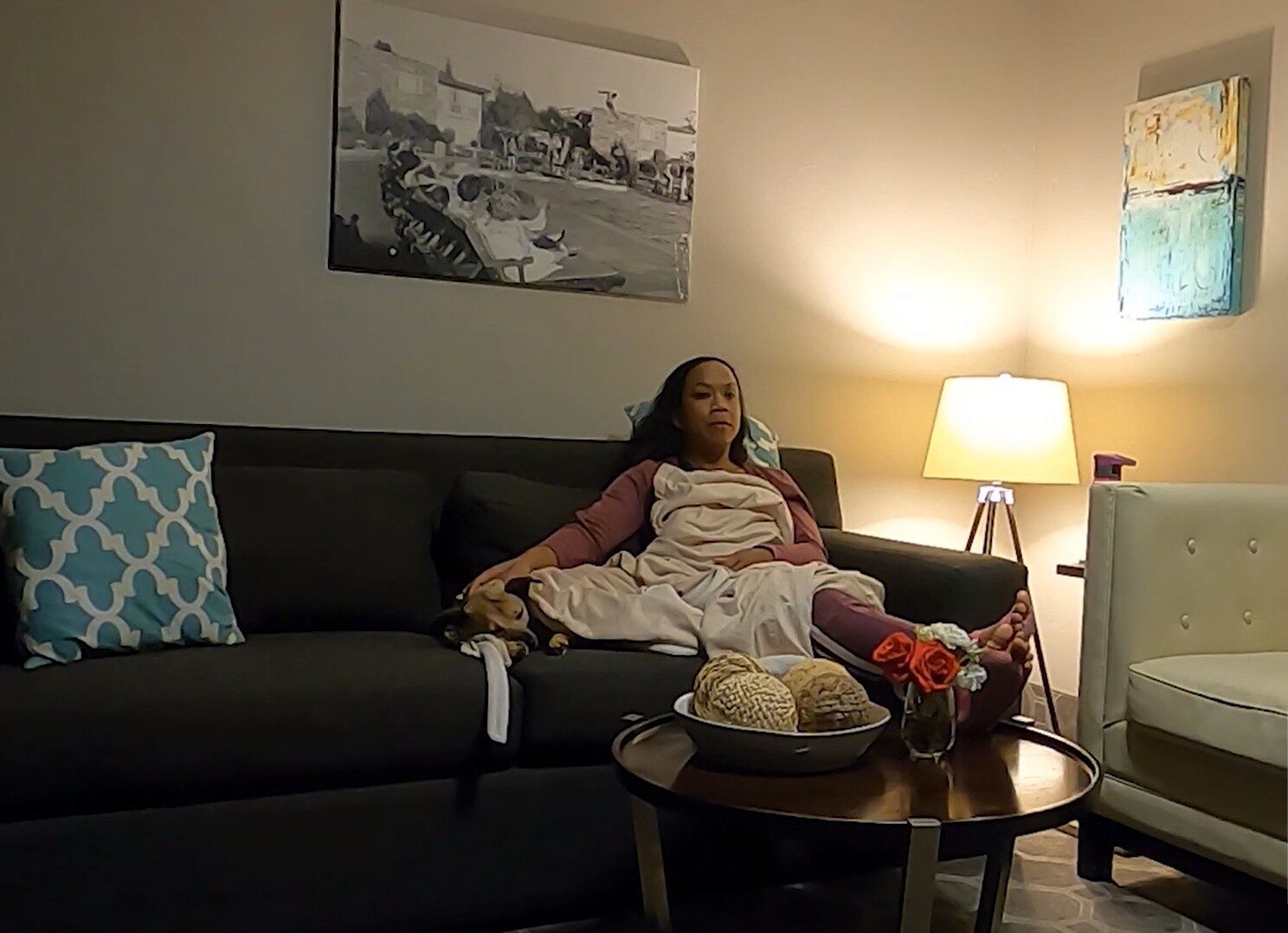 Kamala & Lovie on couch at Flamingo resort at night watching TV for pet friendly concierge